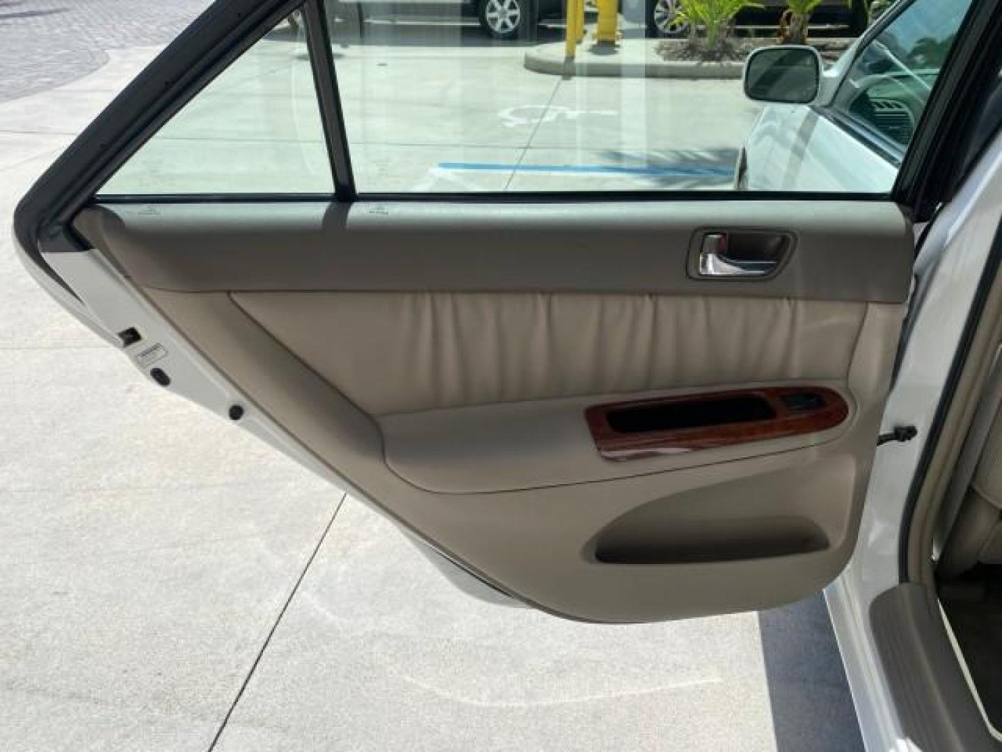 2006 Super White /Taupe Toyota Camry XLE V6 LOW MILES 65,439 (4T1BF30K76U) with an 3.0L DOHC SEFI 24-Valve V6 Engine engine, Automatic transmission, located at 4701 North Dixie Hwy, Pompano Beach, FL, 33064, (954) 422-2889, 26.240938, -80.123474 - OUR WEBPAGE FLORIDACARS1.COM HAS OVER 100 PHOTOS AND FREE CARFAX LINK 2006 Toyota Camry XLE V6 1 OWNER Sedan 4 DR 3.0L V6 F DOHC 24V Gasoline 29 MPG Front Wheel Drive Features ABS Brakes Air Conditioning Alloy Wheels AM/FM Stereo Automatic Transmission Cassette Player CD Audio Cruise Control JBL Sou- Photo#76