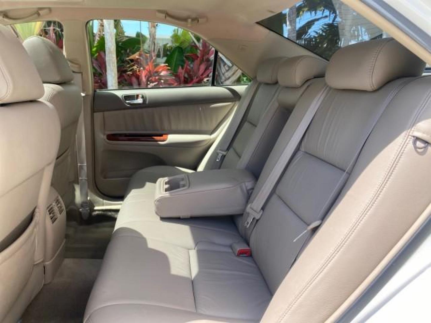 2006 Super White /Taupe Toyota Camry XLE V6 LOW MILES 65,439 (4T1BF30K76U) with an 3.0L DOHC SEFI 24-Valve V6 Engine engine, Automatic transmission, located at 4701 North Dixie Hwy, Pompano Beach, FL, 33064, (954) 422-2889, 26.240938, -80.123474 - OUR WEBPAGE FLORIDACARS1.COM HAS OVER 100 PHOTOS AND FREE CARFAX LINK 2006 Toyota Camry XLE V6 1 OWNER Sedan 4 DR 3.0L V6 F DOHC 24V Gasoline 29 MPG Front Wheel Drive Features ABS Brakes Air Conditioning Alloy Wheels AM/FM Stereo Automatic Transmission Cassette Player CD Audio Cruise Control JBL Sou- Photo#77