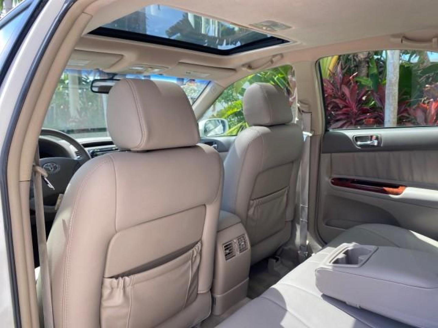 2006 Super White /Taupe Toyota Camry XLE V6 LOW MILES 65,439 (4T1BF30K76U) with an 3.0L DOHC SEFI 24-Valve V6 Engine engine, Automatic transmission, located at 4701 North Dixie Hwy, Pompano Beach, FL, 33064, (954) 422-2889, 26.240938, -80.123474 - OUR WEBPAGE FLORIDACARS1.COM HAS OVER 100 PHOTOS AND FREE CARFAX LINK 2006 Toyota Camry XLE V6 1 OWNER Sedan 4 DR 3.0L V6 F DOHC 24V Gasoline 29 MPG Front Wheel Drive Features ABS Brakes Air Conditioning Alloy Wheels AM/FM Stereo Automatic Transmission Cassette Player CD Audio Cruise Control JBL Sou- Photo#81