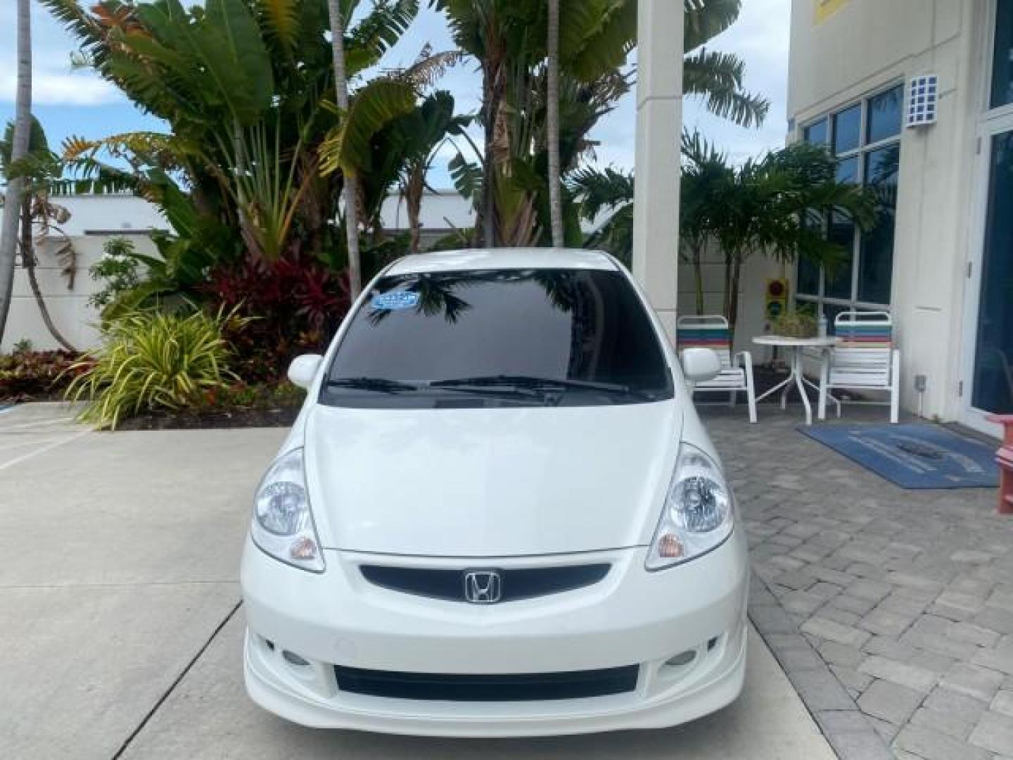 2007 Taffeta White /Black Honda Fit 37 MPG AUTO AC Sport LOW MILES 40,042 (JHMGD38687S) with an 1.5L SOHC PGM-FI 16-Valve VTEC I4 Engine engine, Automatic transmission, located at 4701 North Dixie Hwy, Pompano Beach, FL, 33064, (954) 422-2889, 26.240938, -80.123474 - OUR WEBPAGE FLORIDACARS1.COM HAS OVER 100 PHOTOS AND FREE CARFAX LINK 2007 Honda Fit Sport Hatchback 4 DR 1.5L I4 F SOHC Gasoline 37 MPG Front Wheel Drive Features ABS Brakes Air Conditioning Alloy Wheels AM/FM Stereo Automatic Transmission Auxiliary Audio Input CD Audio Cloth Seats Cruise Control O- Photo#2