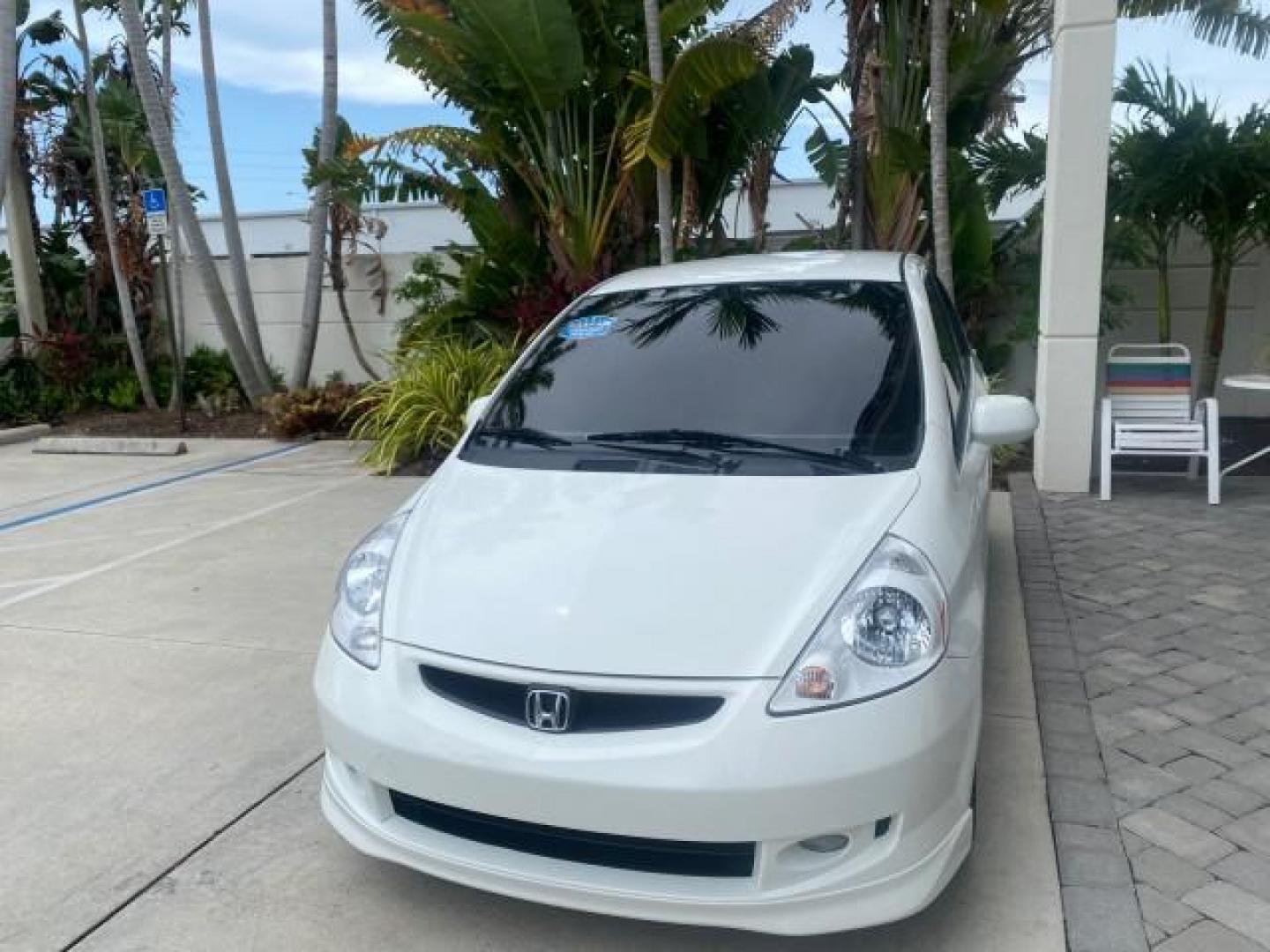 2007 Taffeta White /Black Honda Fit 37 MPG AUTO AC Sport LOW MILES 40,042 (JHMGD38687S) with an 1.5L SOHC PGM-FI 16-Valve VTEC I4 Engine engine, Automatic transmission, located at 4701 North Dixie Hwy, Pompano Beach, FL, 33064, (954) 422-2889, 26.240938, -80.123474 - OUR WEBPAGE FLORIDACARS1.COM HAS OVER 100 PHOTOS AND FREE CARFAX LINK 2007 Honda Fit Sport Hatchback 4 DR 1.5L I4 F SOHC Gasoline 37 MPG Front Wheel Drive Features ABS Brakes Air Conditioning Alloy Wheels AM/FM Stereo Automatic Transmission Auxiliary Audio Input CD Audio Cloth Seats Cruise Control O- Photo#3