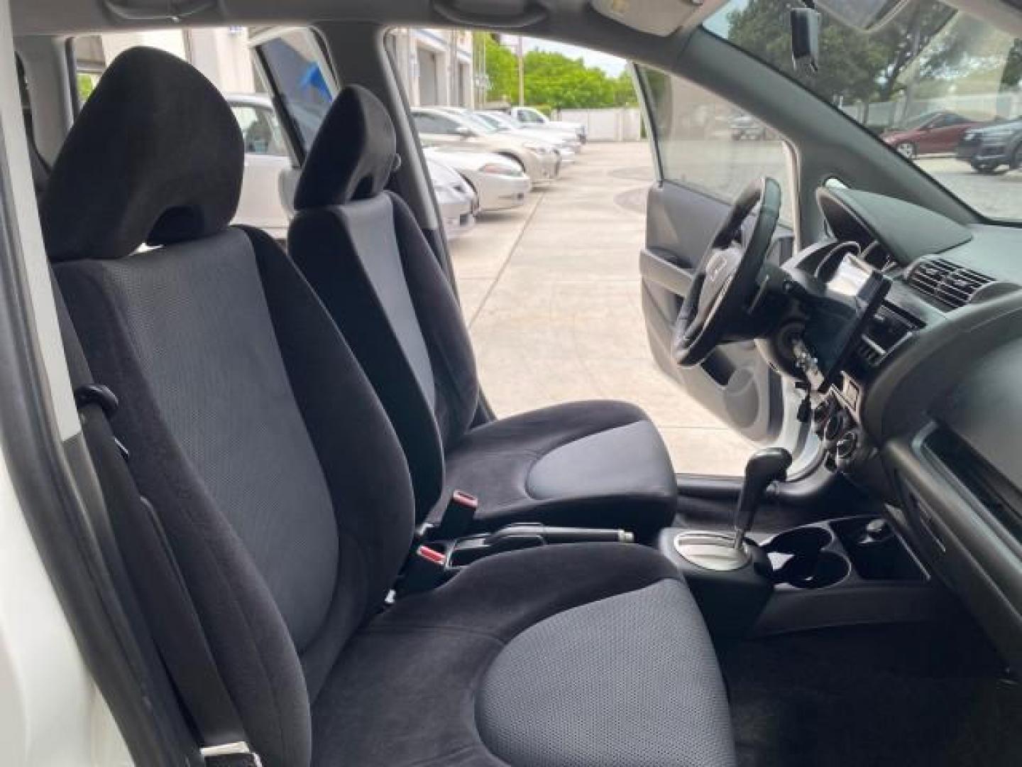2007 Taffeta White /Black Honda Fit 37 MPG AUTO AC Sport LOW MILES 40,042 (JHMGD38687S) with an 1.5L SOHC PGM-FI 16-Valve VTEC I4 Engine engine, Automatic transmission, located at 4701 North Dixie Hwy, Pompano Beach, FL, 33064, (954) 422-2889, 26.240938, -80.123474 - OUR WEBPAGE FLORIDACARS1.COM HAS OVER 100 PHOTOS AND FREE CARFAX LINK 2007 Honda Fit Sport Hatchback 4 DR 1.5L I4 F SOHC Gasoline 37 MPG Front Wheel Drive Features ABS Brakes Air Conditioning Alloy Wheels AM/FM Stereo Automatic Transmission Auxiliary Audio Input CD Audio Cloth Seats Cruise Control O- Photo#12