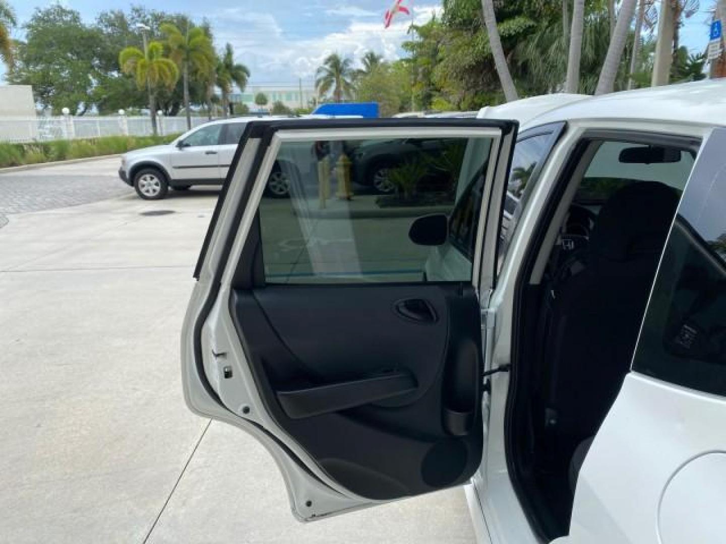 2007 Taffeta White /Black Honda Fit 37 MPG AUTO AC Sport LOW MILES 40,042 (JHMGD38687S) with an 1.5L SOHC PGM-FI 16-Valve VTEC I4 Engine engine, Automatic transmission, located at 4701 North Dixie Hwy, Pompano Beach, FL, 33064, (954) 422-2889, 26.240938, -80.123474 - OUR WEBPAGE FLORIDACARS1.COM HAS OVER 100 PHOTOS AND FREE CARFAX LINK 2007 Honda Fit Sport Hatchback 4 DR 1.5L I4 F SOHC Gasoline 37 MPG Front Wheel Drive Features ABS Brakes Air Conditioning Alloy Wheels AM/FM Stereo Automatic Transmission Auxiliary Audio Input CD Audio Cloth Seats Cruise Control O- Photo#13