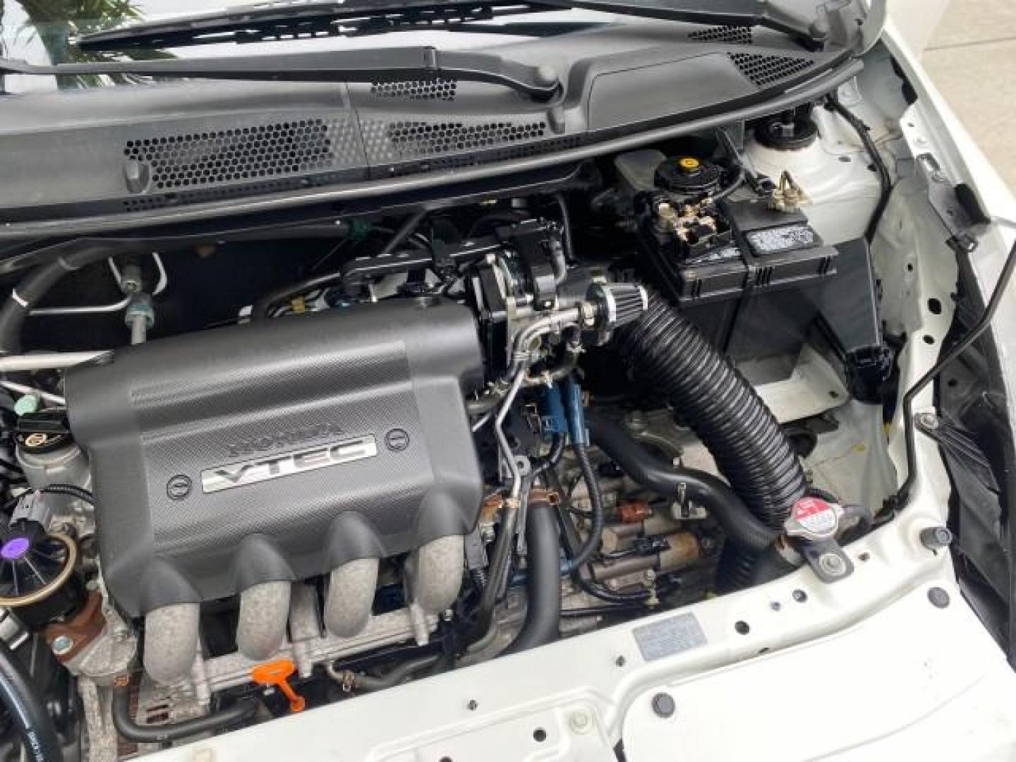 2007 Taffeta White /Black Honda Fit 37 MPG AUTO AC Sport LOW MILES 40,042 (JHMGD38687S) with an 1.5L SOHC PGM-FI 16-Valve VTEC I4 Engine engine, Automatic transmission, located at 4701 North Dixie Hwy, Pompano Beach, FL, 33064, (954) 422-2889, 26.240938, -80.123474 - OUR WEBPAGE FLORIDACARS1.COM HAS OVER 100 PHOTOS AND FREE CARFAX LINK 2007 Honda Fit Sport Hatchback 4 DR 1.5L I4 F SOHC Gasoline 37 MPG Front Wheel Drive Features ABS Brakes Air Conditioning Alloy Wheels AM/FM Stereo Automatic Transmission Auxiliary Audio Input CD Audio Cloth Seats Cruise Control O- Photo#25