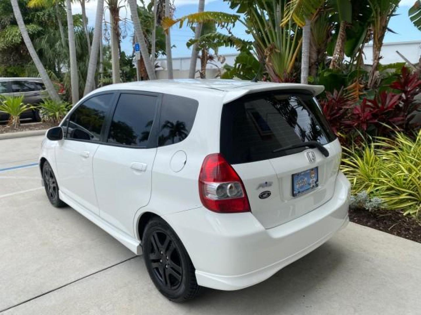 2007 Taffeta White /Black Honda Fit 37 MPG AUTO AC Sport LOW MILES 40,042 (JHMGD38687S) with an 1.5L SOHC PGM-FI 16-Valve VTEC I4 Engine engine, Automatic transmission, located at 4701 North Dixie Hwy, Pompano Beach, FL, 33064, (954) 422-2889, 26.240938, -80.123474 - OUR WEBPAGE FLORIDACARS1.COM HAS OVER 100 PHOTOS AND FREE CARFAX LINK 2007 Honda Fit Sport Hatchback 4 DR 1.5L I4 F SOHC Gasoline 37 MPG Front Wheel Drive Features ABS Brakes Air Conditioning Alloy Wheels AM/FM Stereo Automatic Transmission Auxiliary Audio Input CD Audio Cloth Seats Cruise Control O- Photo#33