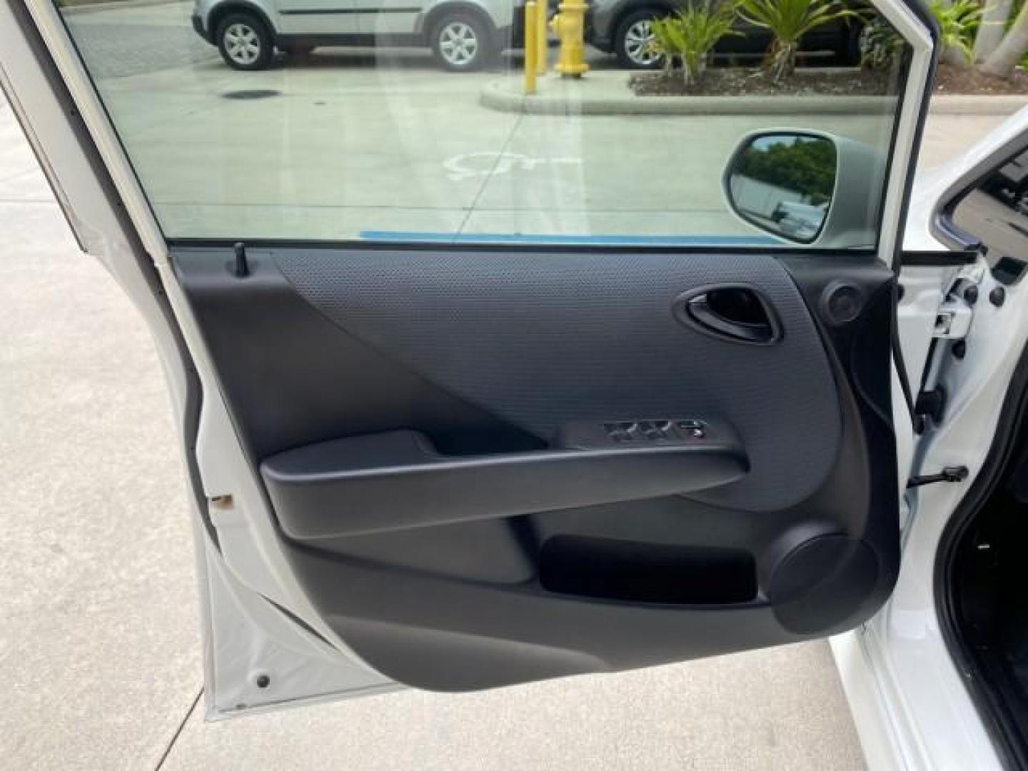 2007 Taffeta White /Black Honda Fit 37 MPG AUTO AC Sport LOW MILES 40,042 (JHMGD38687S) with an 1.5L SOHC PGM-FI 16-Valve VTEC I4 Engine engine, Automatic transmission, located at 4701 North Dixie Hwy, Pompano Beach, FL, 33064, (954) 422-2889, 26.240938, -80.123474 - OUR WEBPAGE FLORIDACARS1.COM HAS OVER 100 PHOTOS AND FREE CARFAX LINK 2007 Honda Fit Sport Hatchback 4 DR 1.5L I4 F SOHC Gasoline 37 MPG Front Wheel Drive Features ABS Brakes Air Conditioning Alloy Wheels AM/FM Stereo Automatic Transmission Auxiliary Audio Input CD Audio Cloth Seats Cruise Control O- Photo#41