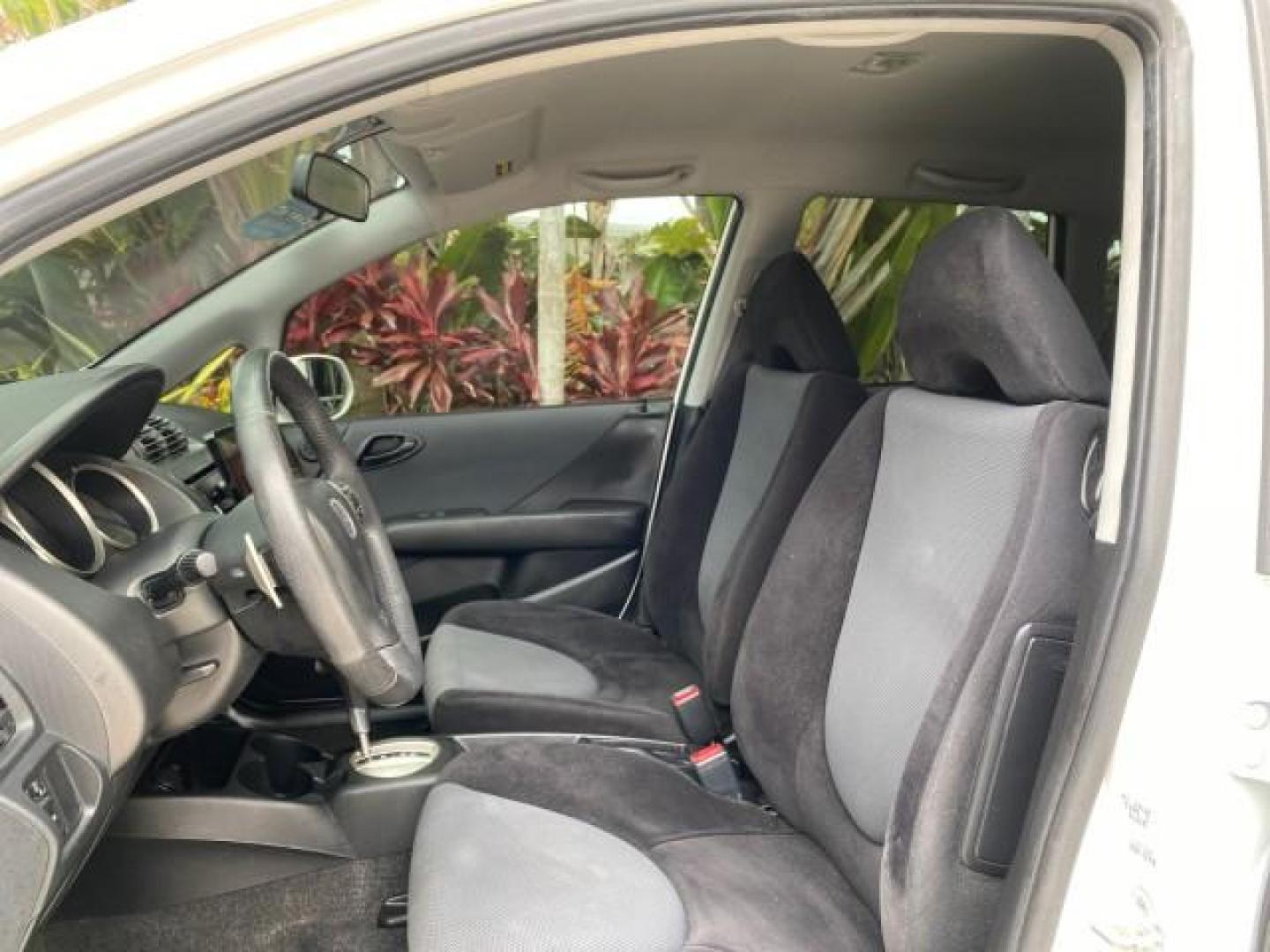 2007 Taffeta White /Black Honda Fit 37 MPG AUTO AC Sport LOW MILES 40,042 (JHMGD38687S) with an 1.5L SOHC PGM-FI 16-Valve VTEC I4 Engine engine, Automatic transmission, located at 4701 North Dixie Hwy, Pompano Beach, FL, 33064, (954) 422-2889, 26.240938, -80.123474 - OUR WEBPAGE FLORIDACARS1.COM HAS OVER 100 PHOTOS AND FREE CARFAX LINK 2007 Honda Fit Sport Hatchback 4 DR 1.5L I4 F SOHC Gasoline 37 MPG Front Wheel Drive Features ABS Brakes Air Conditioning Alloy Wheels AM/FM Stereo Automatic Transmission Auxiliary Audio Input CD Audio Cloth Seats Cruise Control O- Photo#42