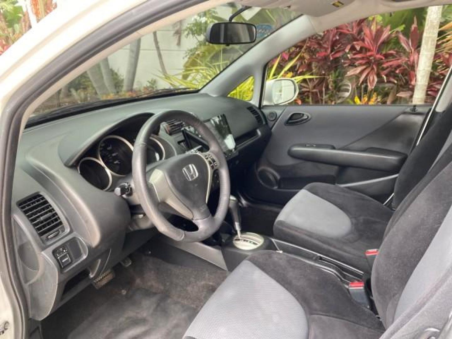 2007 Taffeta White /Black Honda Fit 37 MPG AUTO AC Sport LOW MILES 40,042 (JHMGD38687S) with an 1.5L SOHC PGM-FI 16-Valve VTEC I4 Engine engine, Automatic transmission, located at 4701 North Dixie Hwy, Pompano Beach, FL, 33064, (954) 422-2889, 26.240938, -80.123474 - OUR WEBPAGE FLORIDACARS1.COM HAS OVER 100 PHOTOS AND FREE CARFAX LINK 2007 Honda Fit Sport Hatchback 4 DR 1.5L I4 F SOHC Gasoline 37 MPG Front Wheel Drive Features ABS Brakes Air Conditioning Alloy Wheels AM/FM Stereo Automatic Transmission Auxiliary Audio Input CD Audio Cloth Seats Cruise Control O- Photo#44