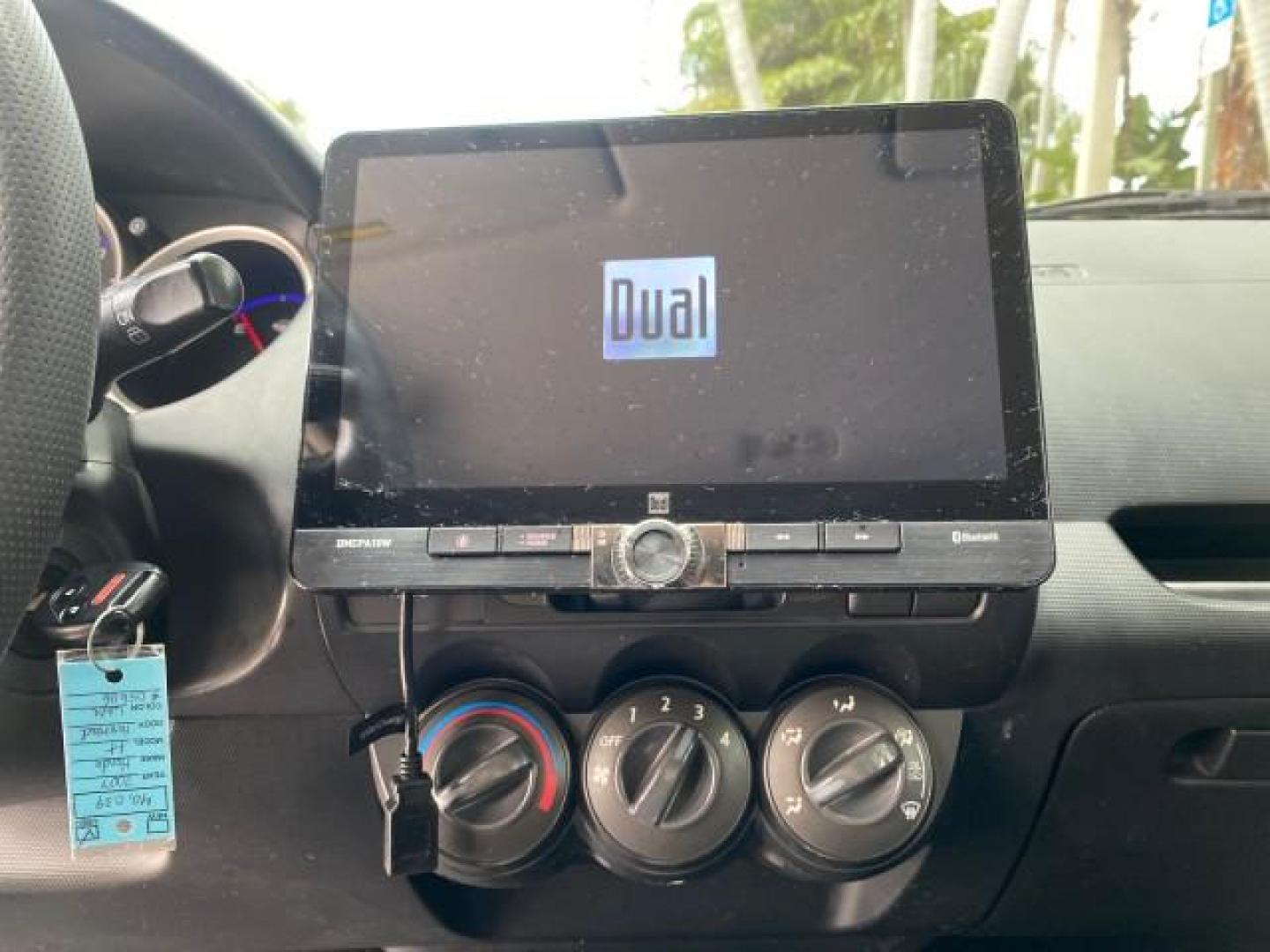2007 Taffeta White /Black Honda Fit 37 MPG AUTO AC Sport LOW MILES 40,042 (JHMGD38687S) with an 1.5L SOHC PGM-FI 16-Valve VTEC I4 Engine engine, Automatic transmission, located at 4701 North Dixie Hwy, Pompano Beach, FL, 33064, (954) 422-2889, 26.240938, -80.123474 - OUR WEBPAGE FLORIDACARS1.COM HAS OVER 100 PHOTOS AND FREE CARFAX LINK 2007 Honda Fit Sport Hatchback 4 DR 1.5L I4 F SOHC Gasoline 37 MPG Front Wheel Drive Features ABS Brakes Air Conditioning Alloy Wheels AM/FM Stereo Automatic Transmission Auxiliary Audio Input CD Audio Cloth Seats Cruise Control O- Photo#54