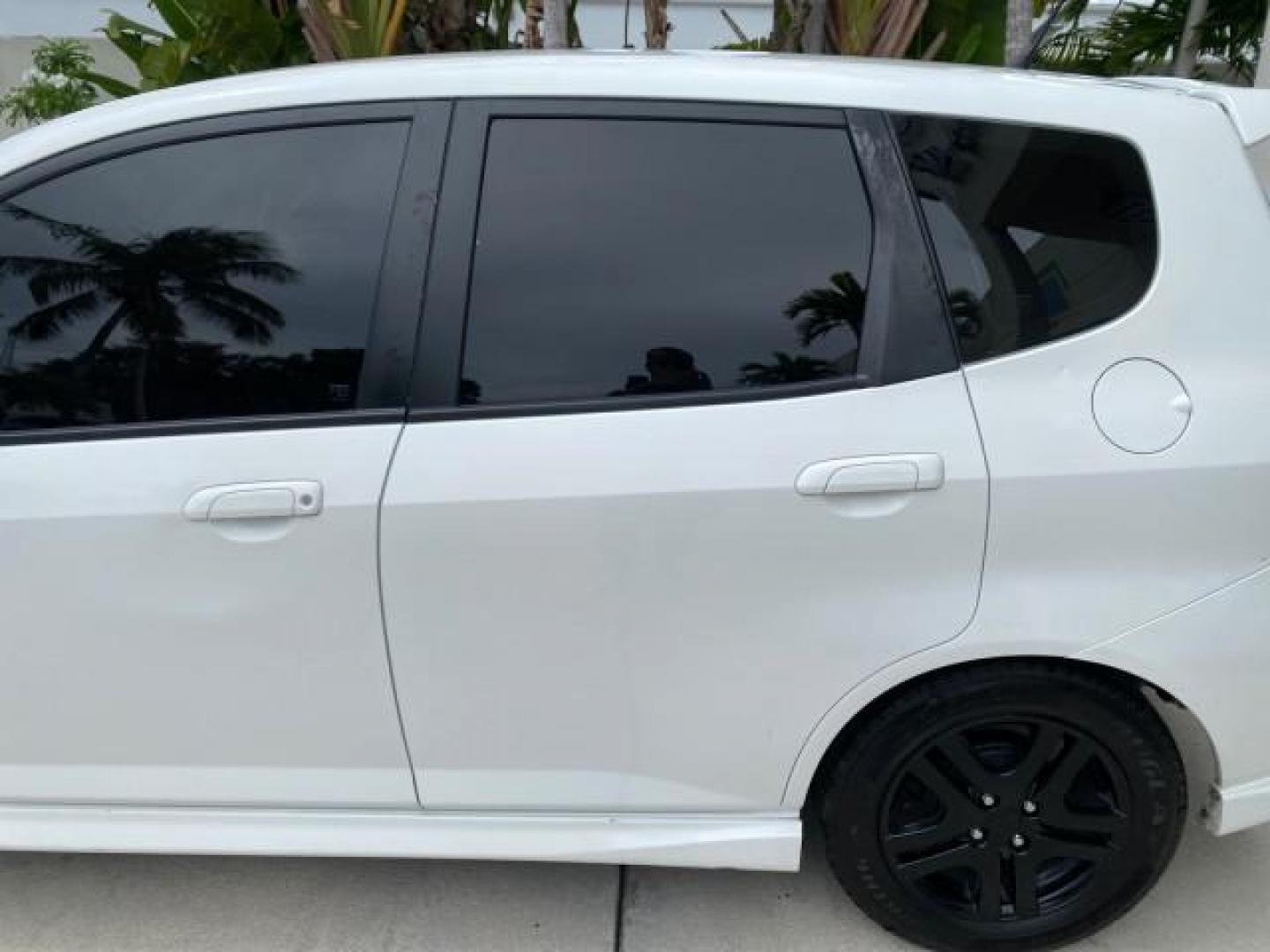2007 Taffeta White /Black Honda Fit 37 MPG AUTO AC Sport LOW MILES 40,042 (JHMGD38687S) with an 1.5L SOHC PGM-FI 16-Valve VTEC I4 Engine engine, Automatic transmission, located at 4701 North Dixie Hwy, Pompano Beach, FL, 33064, (954) 422-2889, 26.240938, -80.123474 - OUR WEBPAGE FLORIDACARS1.COM HAS OVER 100 PHOTOS AND FREE CARFAX LINK 2007 Honda Fit Sport Hatchback 4 DR 1.5L I4 F SOHC Gasoline 37 MPG Front Wheel Drive Features ABS Brakes Air Conditioning Alloy Wheels AM/FM Stereo Automatic Transmission Auxiliary Audio Input CD Audio Cloth Seats Cruise Control O- Photo#67