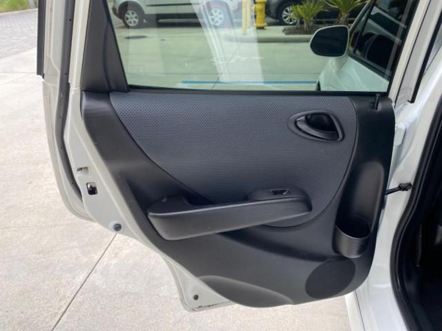 2007 Taffeta White /Black Honda Fit 37 MPG AUTO AC Sport LOW MILES 40,042 (JHMGD38687S) with an 1.5L SOHC PGM-FI 16-Valve VTEC I4 Engine engine, Automatic transmission, located at 4701 North Dixie Hwy, Pompano Beach, FL, 33064, (954) 422-2889, 26.240938, -80.123474 - OUR WEBPAGE FLORIDACARS1.COM HAS OVER 100 PHOTOS AND FREE CARFAX LINK 2007 Honda Fit Sport Hatchback 4 DR 1.5L I4 F SOHC Gasoline 37 MPG Front Wheel Drive Features ABS Brakes Air Conditioning Alloy Wheels AM/FM Stereo Automatic Transmission Auxiliary Audio Input CD Audio Cloth Seats Cruise Control O- Photo#69