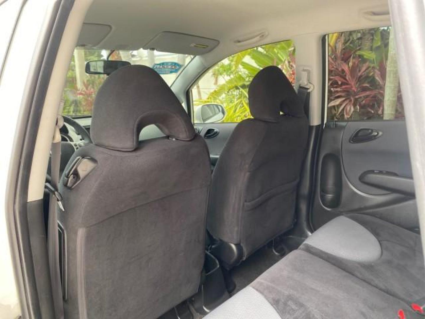 2007 Taffeta White /Black Honda Fit 37 MPG AUTO AC Sport LOW MILES 40,042 (JHMGD38687S) with an 1.5L SOHC PGM-FI 16-Valve VTEC I4 Engine engine, Automatic transmission, located at 4701 North Dixie Hwy, Pompano Beach, FL, 33064, (954) 422-2889, 26.240938, -80.123474 - OUR WEBPAGE FLORIDACARS1.COM HAS OVER 100 PHOTOS AND FREE CARFAX LINK 2007 Honda Fit Sport Hatchback 4 DR 1.5L I4 F SOHC Gasoline 37 MPG Front Wheel Drive Features ABS Brakes Air Conditioning Alloy Wheels AM/FM Stereo Automatic Transmission Auxiliary Audio Input CD Audio Cloth Seats Cruise Control O- Photo#75