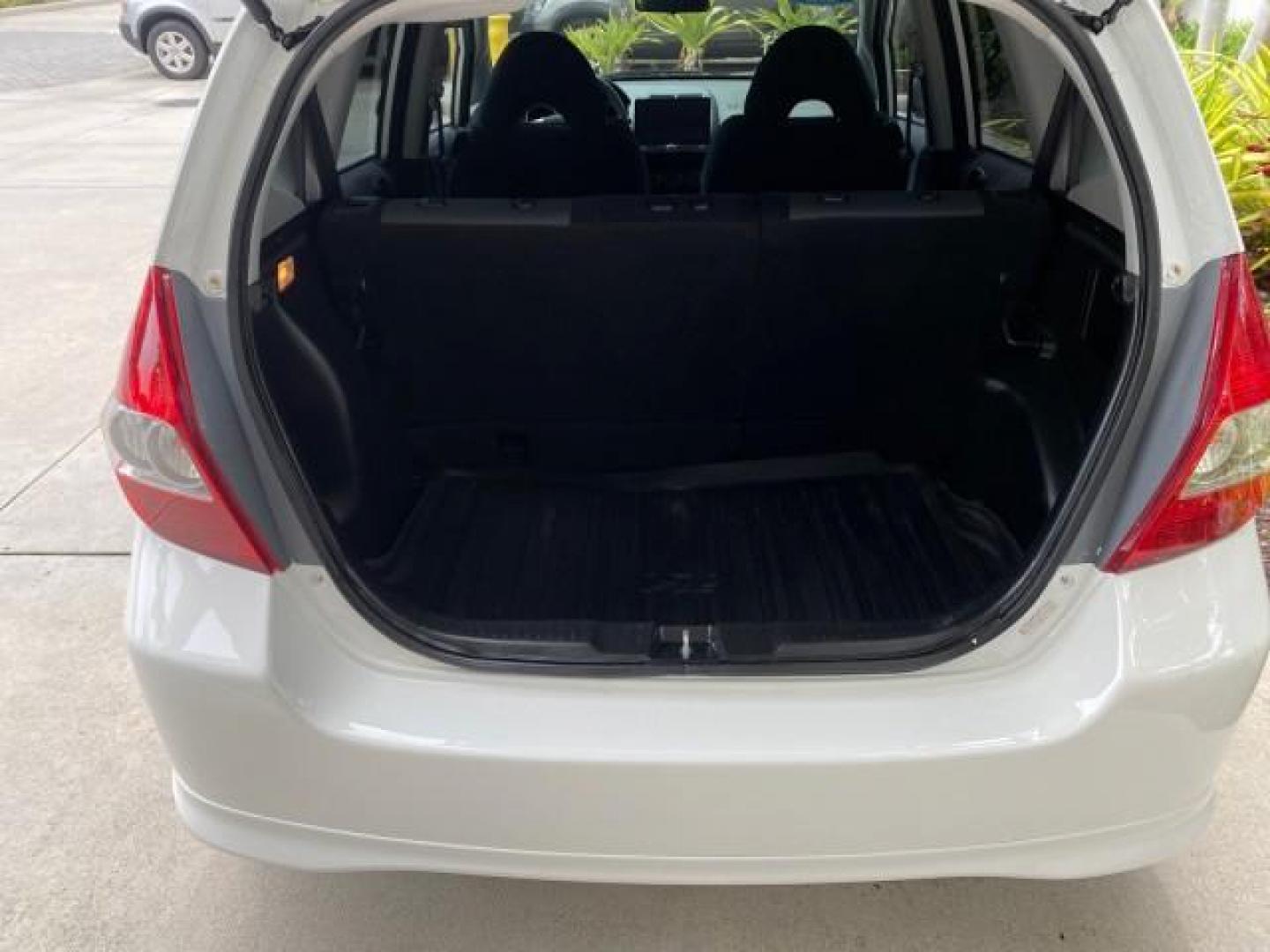 2007 Taffeta White /Black Honda Fit 37 MPG AUTO AC Sport LOW MILES 40,042 (JHMGD38687S) with an 1.5L SOHC PGM-FI 16-Valve VTEC I4 Engine engine, Automatic transmission, located at 4701 North Dixie Hwy, Pompano Beach, FL, 33064, (954) 422-2889, 26.240938, -80.123474 - OUR WEBPAGE FLORIDACARS1.COM HAS OVER 100 PHOTOS AND FREE CARFAX LINK 2007 Honda Fit Sport Hatchback 4 DR 1.5L I4 F SOHC Gasoline 37 MPG Front Wheel Drive Features ABS Brakes Air Conditioning Alloy Wheels AM/FM Stereo Automatic Transmission Auxiliary Audio Input CD Audio Cloth Seats Cruise Control O- Photo#90
