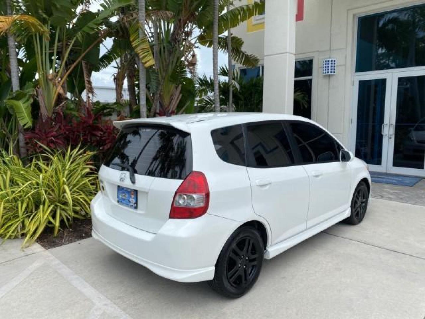 2007 Taffeta White /Black Honda Fit 37 MPG AUTO AC Sport LOW MILES 40,042 (JHMGD38687S) with an 1.5L SOHC PGM-FI 16-Valve VTEC I4 Engine engine, Automatic transmission, located at 4701 North Dixie Hwy, Pompano Beach, FL, 33064, (954) 422-2889, 26.240938, -80.123474 - OUR WEBPAGE FLORIDACARS1.COM HAS OVER 100 PHOTOS AND FREE CARFAX LINK 2007 Honda Fit Sport Hatchback 4 DR 1.5L I4 F SOHC Gasoline 37 MPG Front Wheel Drive Features ABS Brakes Air Conditioning Alloy Wheels AM/FM Stereo Automatic Transmission Auxiliary Audio Input CD Audio Cloth Seats Cruise Control O- Photo#96