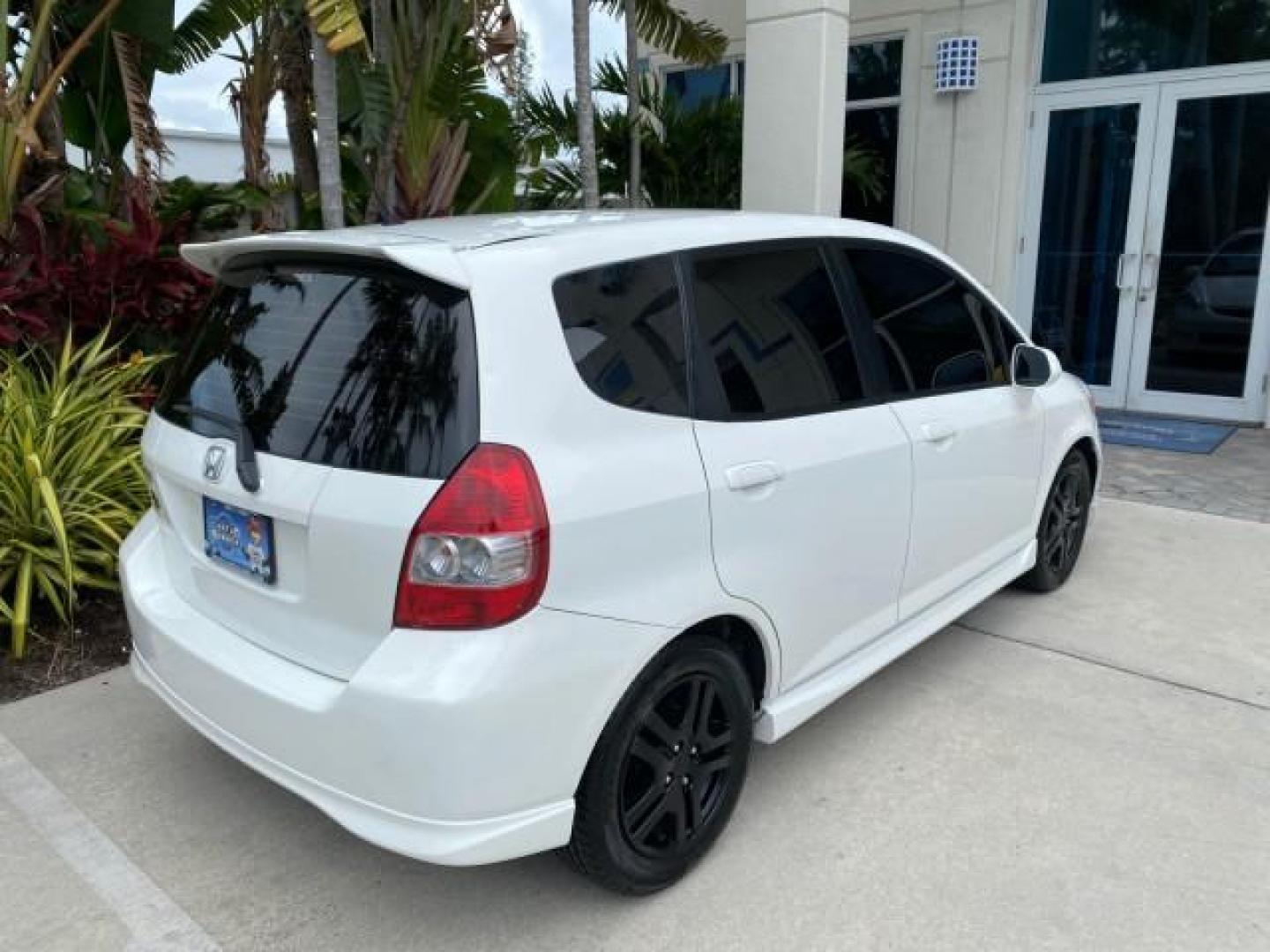 2007 Taffeta White /Black Honda Fit 37 MPG AUTO AC Sport LOW MILES 40,042 (JHMGD38687S) with an 1.5L SOHC PGM-FI 16-Valve VTEC I4 Engine engine, Automatic transmission, located at 4701 North Dixie Hwy, Pompano Beach, FL, 33064, (954) 422-2889, 26.240938, -80.123474 - OUR WEBPAGE FLORIDACARS1.COM HAS OVER 100 PHOTOS AND FREE CARFAX LINK 2007 Honda Fit Sport Hatchback 4 DR 1.5L I4 F SOHC Gasoline 37 MPG Front Wheel Drive Features ABS Brakes Air Conditioning Alloy Wheels AM/FM Stereo Automatic Transmission Auxiliary Audio Input CD Audio Cloth Seats Cruise Control O- Photo#97