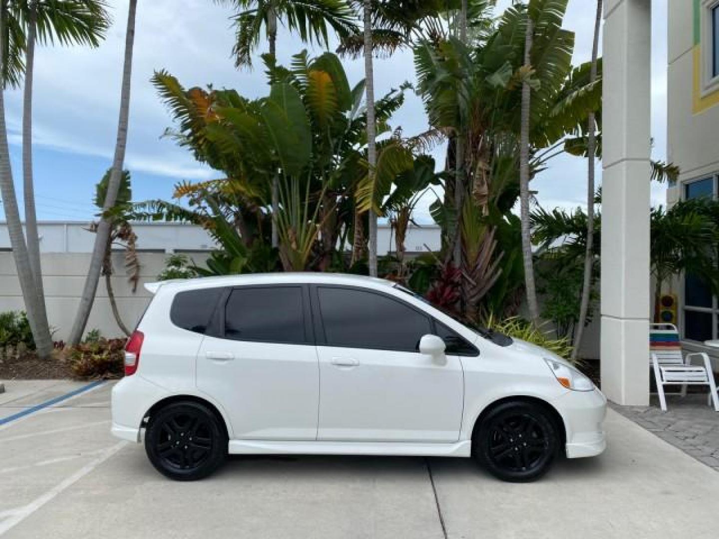 2007 Taffeta White /Black Honda Fit 37 MPG AUTO AC Sport LOW MILES 40,042 (JHMGD38687S) with an 1.5L SOHC PGM-FI 16-Valve VTEC I4 Engine engine, Automatic transmission, located at 4701 North Dixie Hwy, Pompano Beach, FL, 33064, (954) 422-2889, 26.240938, -80.123474 - OUR WEBPAGE FLORIDACARS1.COM HAS OVER 100 PHOTOS AND FREE CARFAX LINK 2007 Honda Fit Sport Hatchback 4 DR 1.5L I4 F SOHC Gasoline 37 MPG Front Wheel Drive Features ABS Brakes Air Conditioning Alloy Wheels AM/FM Stereo Automatic Transmission Auxiliary Audio Input CD Audio Cloth Seats Cruise Control O- Photo#98