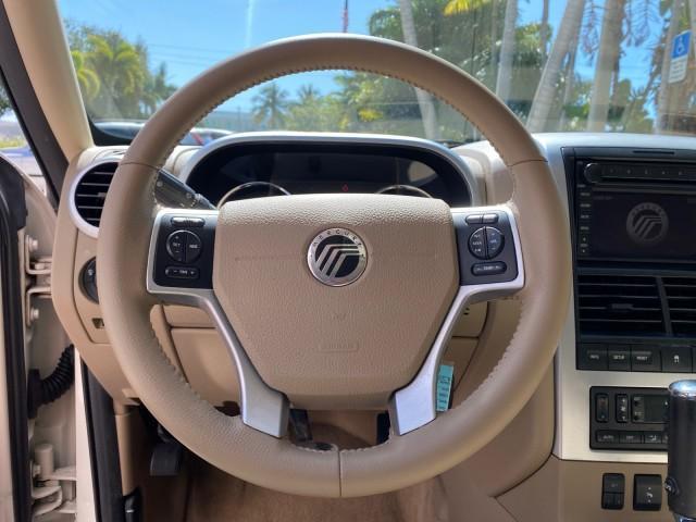 2007 Oxford White /Camel Mercury Mountaineer SUV Premier 1 OWNER (4M2EU38867U) with an 4.6L SOHC 24-Valve V8 Engine engine, Automatic transmission, located at 4701 North Dixie Hwy, Pompano Beach, FL, 33064, (954) 422-2889, 26.240938, -80.123474 - OUR WEBPAGE FLORIDACARS1.COM HAS OVER 100 PHOTOS AND FREE CARFAX LINK 2007 Mercury Mountaineer Premier 4 Door Wagon/Sport Utility 4.6L V8 F SOHC Gasoline 21 MPG Rear Wheel Drive Features ABS Brakes Air Conditioning Alloy Wheels AM/FM Stereo Audiophile Sound System Automatic Transmission Auxiliary Au- Photo#51