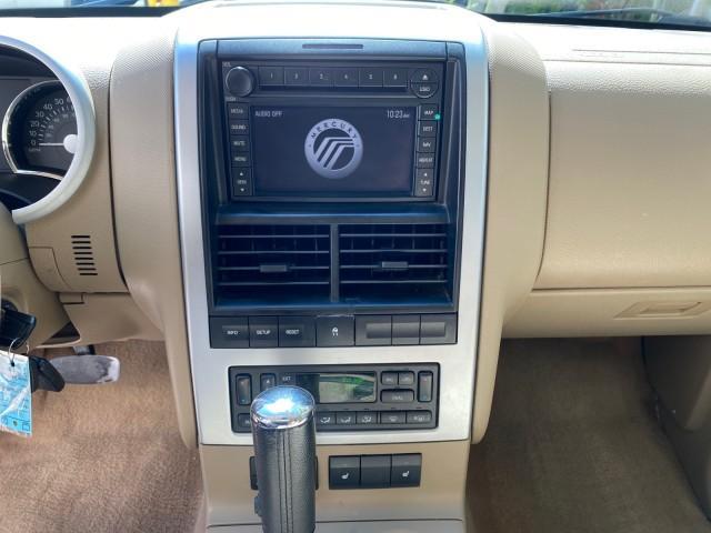 2007 Oxford White /Camel Mercury Mountaineer SUV Premier 1 OWNER (4M2EU38867U) with an 4.6L SOHC 24-Valve V8 Engine engine, Automatic transmission, located at 4701 North Dixie Hwy, Pompano Beach, FL, 33064, (954) 422-2889, 26.240938, -80.123474 - OUR WEBPAGE FLORIDACARS1.COM HAS OVER 100 PHOTOS AND FREE CARFAX LINK 2007 Mercury Mountaineer Premier 4 Door Wagon/Sport Utility 4.6L V8 F SOHC Gasoline 21 MPG Rear Wheel Drive Features ABS Brakes Air Conditioning Alloy Wheels AM/FM Stereo Audiophile Sound System Automatic Transmission Auxiliary Au- Photo#57