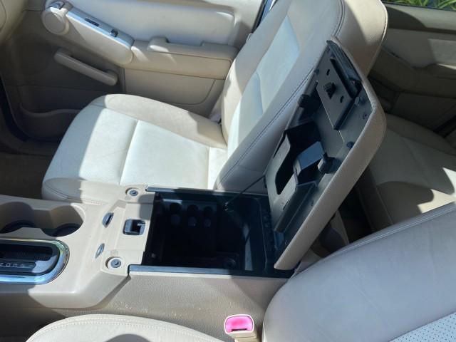 2007 Oxford White /Camel Mercury Mountaineer SUV Premier 1 OWNER (4M2EU38867U) with an 4.6L SOHC 24-Valve V8 Engine engine, Automatic transmission, located at 4701 North Dixie Hwy, Pompano Beach, FL, 33064, (954) 422-2889, 26.240938, -80.123474 - OUR WEBPAGE FLORIDACARS1.COM HAS OVER 100 PHOTOS AND FREE CARFAX LINK 2007 Mercury Mountaineer Premier 4 Door Wagon/Sport Utility 4.6L V8 F SOHC Gasoline 21 MPG Rear Wheel Drive Features ABS Brakes Air Conditioning Alloy Wheels AM/FM Stereo Audiophile Sound System Automatic Transmission Auxiliary Au- Photo#65
