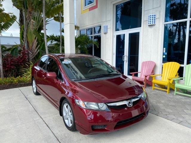 2010 Tango Red Pearl /Black Honda Civic Sdn LX-S LOW MILES 18,946 1 OWNER (2HGFA1F64AH) with an 1.8L SOHC MPFI 16-Valve i-VTEC I4 Engine engine, Automatic transmission, located at 4701 North Dixie Hwy, Pompano Beach, FL, 33064, (954) 422-2889, 26.240938, -80.123474 - OUR WEBPAGE FLORIDACARS1.COM HAS OVER 100 PHOTOS AND FREE CARFAX LINK 2010 Honda Civic LX-S 1 OWNER Sedan 4 DR 1.8L I4 F SOHC 16V Gasoline 36 MPG Front Wheel Drive Features ABS Brakes Air Conditioning Alloy Wheels AM/FM Stereo Automatic Transmission Auxiliary Audio Input CD Audio Cloth Seats Cruise- Photo#1