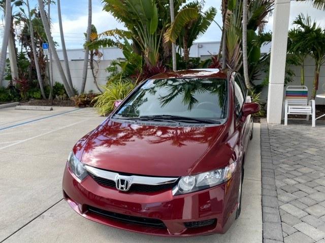 2010 Tango Red Pearl /Black Honda Civic Sdn LX-S LOW MILES 18,946 1 OWNER (2HGFA1F64AH) with an 1.8L SOHC MPFI 16-Valve i-VTEC I4 Engine engine, Automatic transmission, located at 4701 North Dixie Hwy, Pompano Beach, FL, 33064, (954) 422-2889, 26.240938, -80.123474 - OUR WEBPAGE FLORIDACARS1.COM HAS OVER 100 PHOTOS AND FREE CARFAX LINK 2010 Honda Civic LX-S 1 OWNER Sedan 4 DR 1.8L I4 F SOHC 16V Gasoline 36 MPG Front Wheel Drive Features ABS Brakes Air Conditioning Alloy Wheels AM/FM Stereo Automatic Transmission Auxiliary Audio Input CD Audio Cloth Seats Cruise- Photo#3