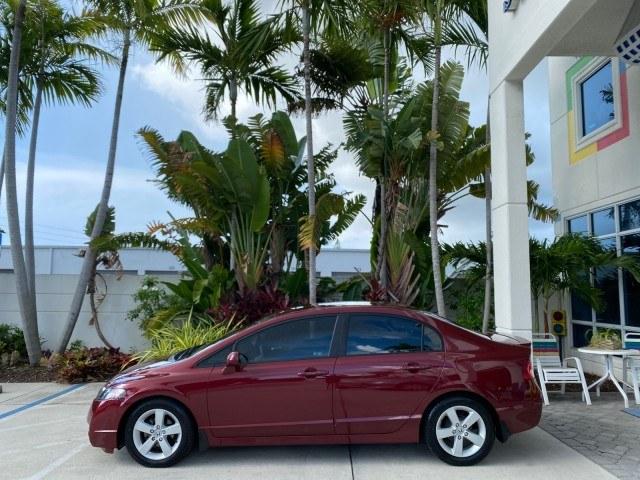2010 Tango Red Pearl /Black Honda Civic Sdn LX-S LOW MILES 18,946 1 OWNER (2HGFA1F64AH) with an 1.8L SOHC MPFI 16-Valve i-VTEC I4 Engine engine, Automatic transmission, located at 4701 North Dixie Hwy, Pompano Beach, FL, 33064, (954) 422-2889, 26.240938, -80.123474 - OUR WEBPAGE FLORIDACARS1.COM HAS OVER 100 PHOTOS AND FREE CARFAX LINK 2010 Honda Civic LX-S 1 OWNER Sedan 4 DR 1.8L I4 F SOHC 16V Gasoline 36 MPG Front Wheel Drive Features ABS Brakes Air Conditioning Alloy Wheels AM/FM Stereo Automatic Transmission Auxiliary Audio Input CD Audio Cloth Seats Cruise- Photo#4