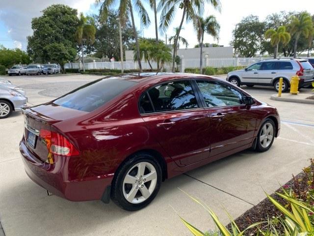 2010 Tango Red Pearl /Black Honda Civic Sdn LX-S LOW MILES 18,946 1 OWNER (2HGFA1F64AH) with an 1.8L SOHC MPFI 16-Valve i-VTEC I4 Engine engine, Automatic transmission, located at 4701 North Dixie Hwy, Pompano Beach, FL, 33064, (954) 422-2889, 26.240938, -80.123474 - OUR WEBPAGE FLORIDACARS1.COM HAS OVER 100 PHOTOS AND FREE CARFAX LINK 2010 Honda Civic LX-S 1 OWNER Sedan 4 DR 1.8L I4 F SOHC 16V Gasoline 36 MPG Front Wheel Drive Features ABS Brakes Air Conditioning Alloy Wheels AM/FM Stereo Automatic Transmission Auxiliary Audio Input CD Audio Cloth Seats Cruise- Photo#7