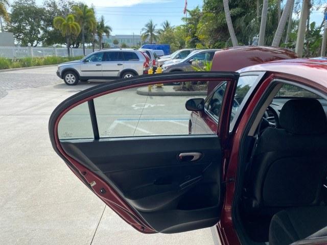 2010 Tango Red Pearl /Black Honda Civic Sdn LX-S LOW MILES 18,946 1 OWNER (2HGFA1F64AH) with an 1.8L SOHC MPFI 16-Valve i-VTEC I4 Engine engine, Automatic transmission, located at 4701 North Dixie Hwy, Pompano Beach, FL, 33064, (954) 422-2889, 26.240938, -80.123474 - OUR WEBPAGE FLORIDACARS1.COM HAS OVER 100 PHOTOS AND FREE CARFAX LINK 2010 Honda Civic LX-S 1 OWNER Sedan 4 DR 1.8L I4 F SOHC 16V Gasoline 36 MPG Front Wheel Drive Features ABS Brakes Air Conditioning Alloy Wheels AM/FM Stereo Automatic Transmission Auxiliary Audio Input CD Audio Cloth Seats Cruise- Photo#13