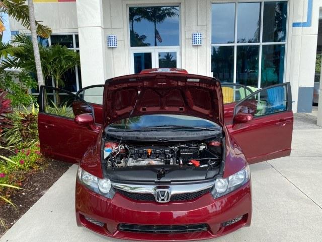 2010 Tango Red Pearl /Black Honda Civic Sdn LX-S LOW MILES 18,946 1 OWNER (2HGFA1F64AH) with an 1.8L SOHC MPFI 16-Valve i-VTEC I4 Engine engine, Automatic transmission, located at 4701 North Dixie Hwy, Pompano Beach, FL, 33064, (954) 422-2889, 26.240938, -80.123474 - OUR WEBPAGE FLORIDACARS1.COM HAS OVER 100 PHOTOS AND FREE CARFAX LINK 2010 Honda Civic LX-S 1 OWNER Sedan 4 DR 1.8L I4 F SOHC 16V Gasoline 36 MPG Front Wheel Drive Features ABS Brakes Air Conditioning Alloy Wheels AM/FM Stereo Automatic Transmission Auxiliary Audio Input CD Audio Cloth Seats Cruise- Photo#17