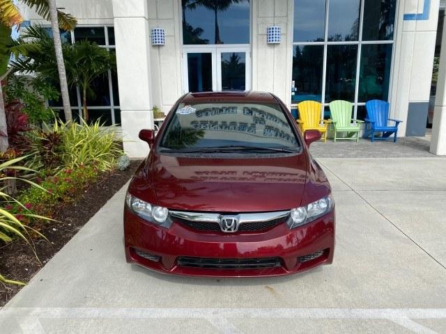 2010 Tango Red Pearl /Black Honda Civic Sdn LX-S LOW MILES 18,946 1 OWNER (2HGFA1F64AH) with an 1.8L SOHC MPFI 16-Valve i-VTEC I4 Engine engine, Automatic transmission, located at 4701 North Dixie Hwy, Pompano Beach, FL, 33064, (954) 422-2889, 26.240938, -80.123474 - OUR WEBPAGE FLORIDACARS1.COM HAS OVER 100 PHOTOS AND FREE CARFAX LINK 2010 Honda Civic LX-S 1 OWNER Sedan 4 DR 1.8L I4 F SOHC 16V Gasoline 36 MPG Front Wheel Drive Features ABS Brakes Air Conditioning Alloy Wheels AM/FM Stereo Automatic Transmission Auxiliary Audio Input CD Audio Cloth Seats Cruise- Photo#26