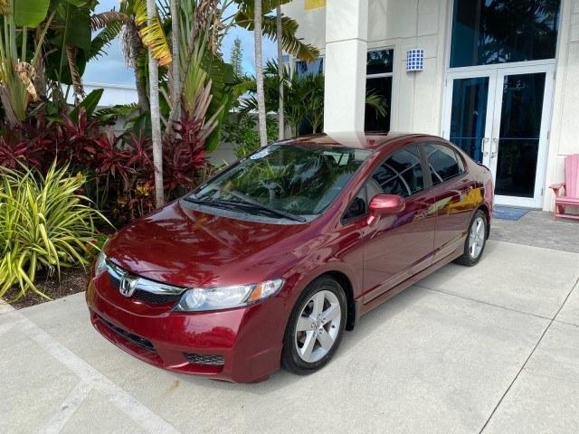 2010 Tango Red Pearl /Black Honda Civic Sdn LX-S LOW MILES 18,946 1 OWNER (2HGFA1F64AH) with an 1.8L SOHC MPFI 16-Valve i-VTEC I4 Engine engine, Automatic transmission, located at 4701 North Dixie Hwy, Pompano Beach, FL, 33064, (954) 422-2889, 26.240938, -80.123474 - OUR WEBPAGE FLORIDACARS1.COM HAS OVER 100 PHOTOS AND FREE CARFAX LINK 2010 Honda Civic LX-S 1 OWNER Sedan 4 DR 1.8L I4 F SOHC 16V Gasoline 36 MPG Front Wheel Drive Features ABS Brakes Air Conditioning Alloy Wheels AM/FM Stereo Automatic Transmission Auxiliary Audio Input CD Audio Cloth Seats Cruise- Photo#28