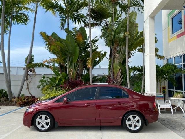 2010 Tango Red Pearl /Black Honda Civic Sdn LX-S LOW MILES 18,946 1 OWNER (2HGFA1F64AH) with an 1.8L SOHC MPFI 16-Valve i-VTEC I4 Engine engine, Automatic transmission, located at 4701 North Dixie Hwy, Pompano Beach, FL, 33064, (954) 422-2889, 26.240938, -80.123474 - OUR WEBPAGE FLORIDACARS1.COM HAS OVER 100 PHOTOS AND FREE CARFAX LINK 2010 Honda Civic LX-S 1 OWNER Sedan 4 DR 1.8L I4 F SOHC 16V Gasoline 36 MPG Front Wheel Drive Features ABS Brakes Air Conditioning Alloy Wheels AM/FM Stereo Automatic Transmission Auxiliary Audio Input CD Audio Cloth Seats Cruise- Photo#30