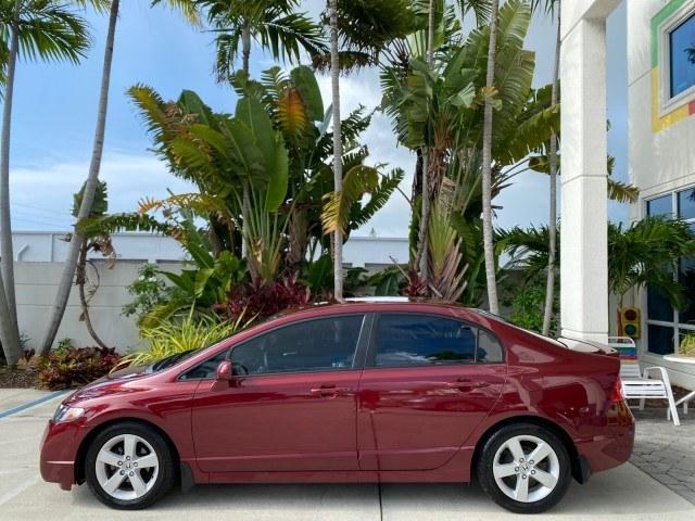 2010 Tango Red Pearl /Black Honda Civic Sdn LX-S LOW MILES 18,946 1 OWNER (2HGFA1F64AH) with an 1.8L SOHC MPFI 16-Valve i-VTEC I4 Engine engine, Automatic transmission, located at 4701 North Dixie Hwy, Pompano Beach, FL, 33064, (954) 422-2889, 26.240938, -80.123474 - OUR WEBPAGE FLORIDACARS1.COM HAS OVER 100 PHOTOS AND FREE CARFAX LINK 2010 Honda Civic LX-S 1 OWNER Sedan 4 DR 1.8L I4 F SOHC 16V Gasoline 36 MPG Front Wheel Drive Features ABS Brakes Air Conditioning Alloy Wheels AM/FM Stereo Automatic Transmission Auxiliary Audio Input CD Audio Cloth Seats Cruise- Photo#31