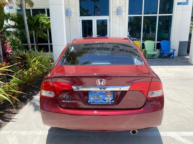 2010 Tango Red Pearl /Black Honda Civic Sdn LX-S LOW MILES 18,946 1 OWNER (2HGFA1F64AH) with an 1.8L SOHC MPFI 16-Valve i-VTEC I4 Engine engine, Automatic transmission, located at 4701 North Dixie Hwy, Pompano Beach, FL, 33064, (954) 422-2889, 26.240938, -80.123474 - OUR WEBPAGE FLORIDACARS1.COM HAS OVER 100 PHOTOS AND FREE CARFAX LINK 2010 Honda Civic LX-S 1 OWNER Sedan 4 DR 1.8L I4 F SOHC 16V Gasoline 36 MPG Front Wheel Drive Features ABS Brakes Air Conditioning Alloy Wheels AM/FM Stereo Automatic Transmission Auxiliary Audio Input CD Audio Cloth Seats Cruise- Photo#98
