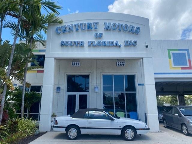 1993 White /Black Chrysler Lebaron CONV LX LOW MILES 26,305 (1C3XU5532PF) with an 3.0L SMFI 6-Cyl Engine engine, Automatic transmission, located at 4701 North Dixie Hwy, Pompano Beach, FL, 33064, (954) 422-2889, 26.240938, -80.123474 - OUR WEBPAGE FLORIDACARS1.COM HAS OVER 100 PHOTOS AND FREE CARFAX LINK 1993 Chrysler LeBaron Convertible 3.0L V6 F SOHC 12V Gasoline Front Wheel Drive Features ABS Brakes Air Conditioning Alloy Wheels AM/FM Stereo Automatic Transmission Cassette Player Cruise Control Leather Seats Power Locks Power S- Photo#0