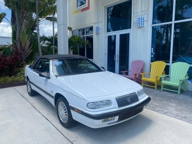 1993 White /Black Chrysler Lebaron CONV LX LOW MILES 26,305 (1C3XU5532PF) with an 3.0L SMFI 6-Cyl Engine engine, Automatic transmission, located at 4701 North Dixie Hwy, Pompano Beach, FL, 33064, (954) 422-2889, 26.240938, -80.123474 - OUR WEBPAGE FLORIDACARS1.COM HAS OVER 100 PHOTOS AND FREE CARFAX LINK 1993 Chrysler LeBaron Convertible 3.0L V6 F SOHC 12V Gasoline Front Wheel Drive Features ABS Brakes Air Conditioning Alloy Wheels AM/FM Stereo Automatic Transmission Cassette Player Cruise Control Leather Seats Power Locks Power S- Photo#1