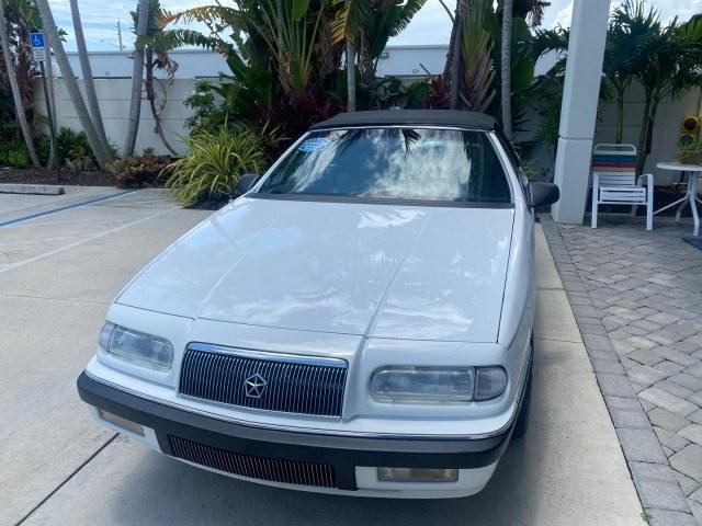 1993 White /Black Chrysler Lebaron CONV LX LOW MILES 26,305 (1C3XU5532PF) with an 3.0L SMFI 6-Cyl Engine engine, Automatic transmission, located at 4701 North Dixie Hwy, Pompano Beach, FL, 33064, (954) 422-2889, 26.240938, -80.123474 - OUR WEBPAGE FLORIDACARS1.COM HAS OVER 100 PHOTOS AND FREE CARFAX LINK 1993 Chrysler LeBaron Convertible 3.0L V6 F SOHC 12V Gasoline Front Wheel Drive Features ABS Brakes Air Conditioning Alloy Wheels AM/FM Stereo Automatic Transmission Cassette Player Cruise Control Leather Seats Power Locks Power S- Photo#3