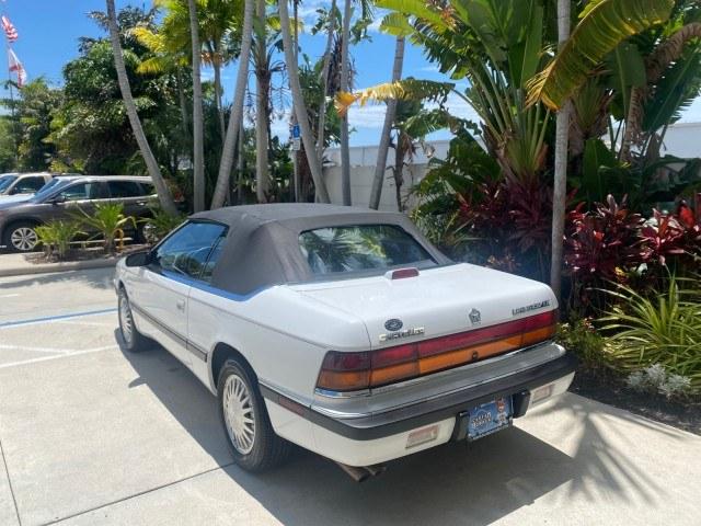 1993 White /Black Chrysler Lebaron CONV LX LOW MILES 26,305 (1C3XU5532PF) with an 3.0L SMFI 6-Cyl Engine engine, Automatic transmission, located at 4701 North Dixie Hwy, Pompano Beach, FL, 33064, (954) 422-2889, 26.240938, -80.123474 - OUR WEBPAGE FLORIDACARS1.COM HAS OVER 100 PHOTOS AND FREE CARFAX LINK 1993 Chrysler LeBaron Convertible 3.0L V6 F SOHC 12V Gasoline Front Wheel Drive Features ABS Brakes Air Conditioning Alloy Wheels AM/FM Stereo Automatic Transmission Cassette Player Cruise Control Leather Seats Power Locks Power S- Photo#5