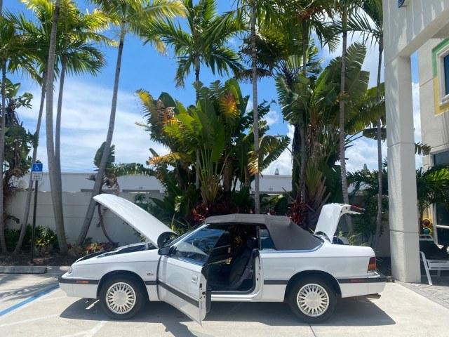 1993 White /Black Chrysler Lebaron CONV LX LOW MILES 26,305 (1C3XU5532PF) with an 3.0L SMFI 6-Cyl Engine engine, Automatic transmission, located at 4701 North Dixie Hwy, Pompano Beach, FL, 33064, (954) 422-2889, 26.240938, -80.123474 - OUR WEBPAGE FLORIDACARS1.COM HAS OVER 100 PHOTOS AND FREE CARFAX LINK 1993 Chrysler LeBaron Convertible 3.0L V6 F SOHC 12V Gasoline Front Wheel Drive Features ABS Brakes Air Conditioning Alloy Wheels AM/FM Stereo Automatic Transmission Cassette Player Cruise Control Leather Seats Power Locks Power S- Photo#8