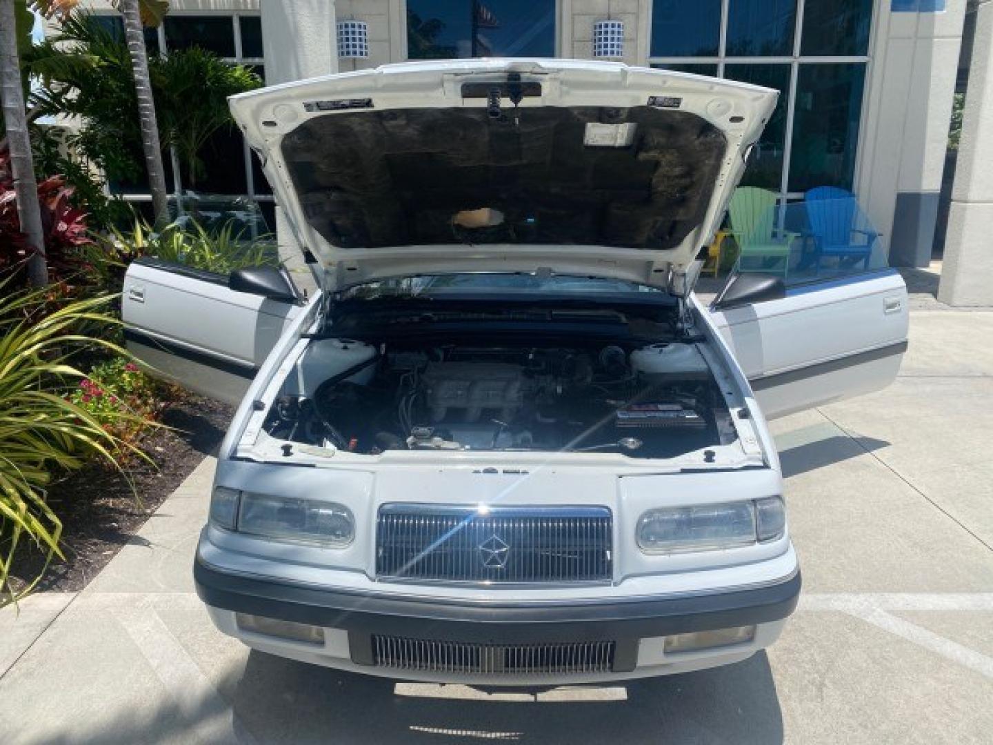 1993 White /Black Chrysler Lebaron CONV LX LOW MILES 26,305 (1C3XU5532PF) with an 3.0L SMFI 6-Cyl Engine engine, Automatic transmission, located at 4701 North Dixie Hwy, Pompano Beach, FL, 33064, (954) 422-2889, 26.240938, -80.123474 - OUR WEBPAGE FLORIDACARS1.COM HAS OVER 100 PHOTOS AND FREE CARFAX LINK 1993 Chrysler LeBaron Convertible 3.0L V6 F SOHC 12V Gasoline Front Wheel Drive Features ABS Brakes Air Conditioning Alloy Wheels AM/FM Stereo Automatic Transmission Cassette Player Cruise Control Leather Seats Power Locks Power S- Photo#17