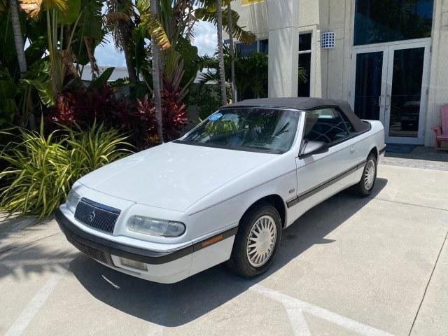 1993 White /Black Chrysler Lebaron CONV LX LOW MILES 26,305 (1C3XU5532PF) with an 3.0L SMFI 6-Cyl Engine engine, Automatic transmission, located at 4701 North Dixie Hwy, Pompano Beach, FL, 33064, (954) 422-2889, 26.240938, -80.123474 - OUR WEBPAGE FLORIDACARS1.COM HAS OVER 100 PHOTOS AND FREE CARFAX LINK 1993 Chrysler LeBaron Convertible 3.0L V6 F SOHC 12V Gasoline Front Wheel Drive Features ABS Brakes Air Conditioning Alloy Wheels AM/FM Stereo Automatic Transmission Cassette Player Cruise Control Leather Seats Power Locks Power S- Photo#28