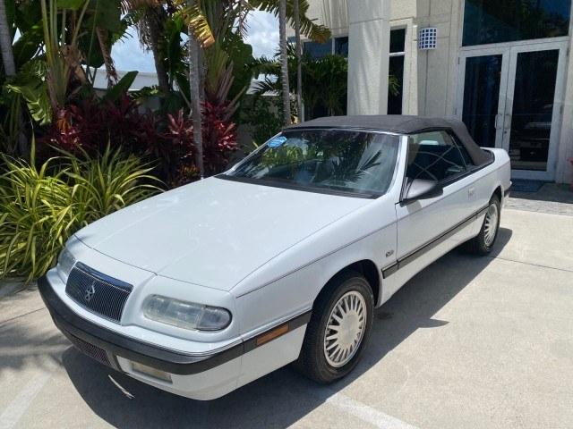 1993 White /Black Chrysler Lebaron CONV LX LOW MILES 26,305 (1C3XU5532PF) with an 3.0L SMFI 6-Cyl Engine engine, Automatic transmission, located at 4701 North Dixie Hwy, Pompano Beach, FL, 33064, (954) 422-2889, 26.240938, -80.123474 - OUR WEBPAGE FLORIDACARS1.COM HAS OVER 100 PHOTOS AND FREE CARFAX LINK 1993 Chrysler LeBaron Convertible 3.0L V6 F SOHC 12V Gasoline Front Wheel Drive Features ABS Brakes Air Conditioning Alloy Wheels AM/FM Stereo Automatic Transmission Cassette Player Cruise Control Leather Seats Power Locks Power S- Photo#29