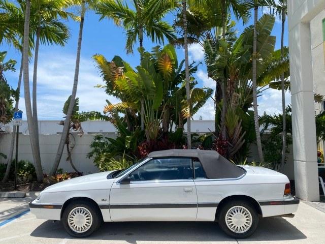 1993 White /Black Chrysler Lebaron CONV LX LOW MILES 26,305 (1C3XU5532PF) with an 3.0L SMFI 6-Cyl Engine engine, Automatic transmission, located at 4701 North Dixie Hwy, Pompano Beach, FL, 33064, (954) 422-2889, 26.240938, -80.123474 - OUR WEBPAGE FLORIDACARS1.COM HAS OVER 100 PHOTOS AND FREE CARFAX LINK 1993 Chrysler LeBaron Convertible 3.0L V6 F SOHC 12V Gasoline Front Wheel Drive Features ABS Brakes Air Conditioning Alloy Wheels AM/FM Stereo Automatic Transmission Cassette Player Cruise Control Leather Seats Power Locks Power S- Photo#31