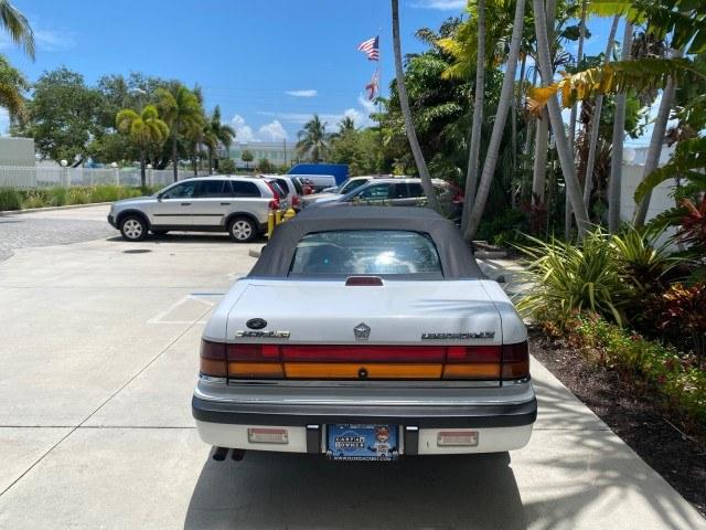 1993 White /Black Chrysler Lebaron CONV LX LOW MILES 26,305 (1C3XU5532PF) with an 3.0L SMFI 6-Cyl Engine engine, Automatic transmission, located at 4701 North Dixie Hwy, Pompano Beach, FL, 33064, (954) 422-2889, 26.240938, -80.123474 - OUR WEBPAGE FLORIDACARS1.COM HAS OVER 100 PHOTOS AND FREE CARFAX LINK 1993 Chrysler LeBaron Convertible 3.0L V6 F SOHC 12V Gasoline Front Wheel Drive Features ABS Brakes Air Conditioning Alloy Wheels AM/FM Stereo Automatic Transmission Cassette Player Cruise Control Leather Seats Power Locks Power S- Photo#34
