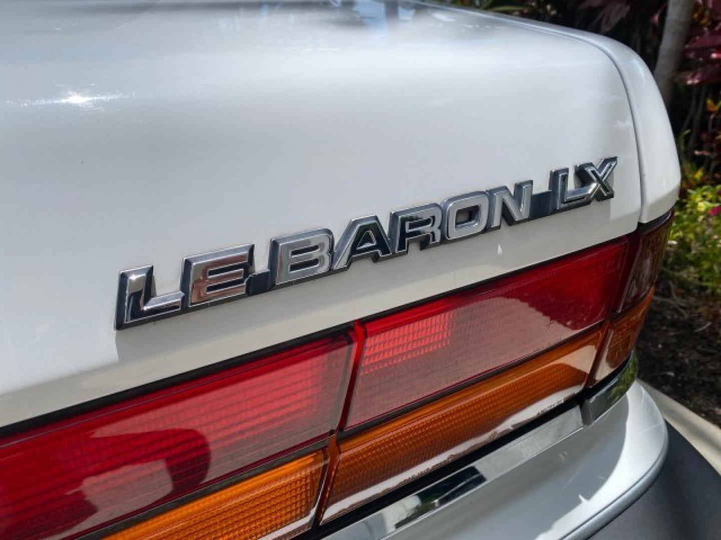 1993 White /Black Chrysler Lebaron CONV LX LOW MILES 26,305 (1C3XU5532PF) with an 3.0L SMFI 6-Cyl Engine engine, Automatic transmission, located at 4701 North Dixie Hwy, Pompano Beach, FL, 33064, (954) 422-2889, 26.240938, -80.123474 - OUR WEBPAGE FLORIDACARS1.COM HAS OVER 100 PHOTOS AND FREE CARFAX LINK 1993 Chrysler LeBaron Convertible 3.0L V6 F SOHC 12V Gasoline Front Wheel Drive Features ABS Brakes Air Conditioning Alloy Wheels AM/FM Stereo Automatic Transmission Cassette Player Cruise Control Leather Seats Power Locks Power S- Photo#78
