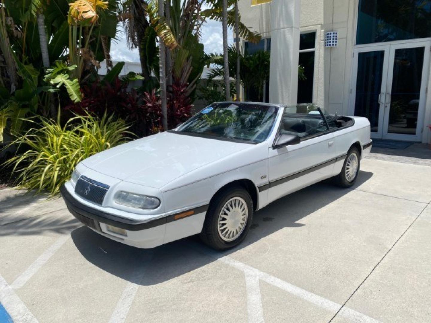 1993 White /Black Chrysler Lebaron CONV LX LOW MILES 26,305 (1C3XU5532PF) with an 3.0L SMFI 6-Cyl Engine engine, Automatic transmission, located at 4701 North Dixie Hwy, Pompano Beach, FL, 33064, (954) 422-2889, 26.240938, -80.123474 - OUR WEBPAGE FLORIDACARS1.COM HAS OVER 100 PHOTOS AND FREE CARFAX LINK 1993 Chrysler LeBaron Convertible 3.0L V6 F SOHC 12V Gasoline Front Wheel Drive Features ABS Brakes Air Conditioning Alloy Wheels AM/FM Stereo Automatic Transmission Cassette Player Cruise Control Leather Seats Power Locks Power S- Photo#84