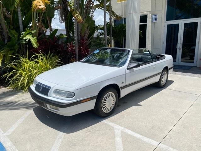 1993 White /Black Chrysler Lebaron CONV LX LOW MILES 26,305 (1C3XU5532PF) with an 3.0L SMFI 6-Cyl Engine engine, Automatic transmission, located at 4701 North Dixie Hwy, Pompano Beach, FL, 33064, (954) 422-2889, 26.240938, -80.123474 - OUR WEBPAGE FLORIDACARS1.COM HAS OVER 100 PHOTOS AND FREE CARFAX LINK 1993 Chrysler LeBaron Convertible 3.0L V6 F SOHC 12V Gasoline Front Wheel Drive Features ABS Brakes Air Conditioning Alloy Wheels AM/FM Stereo Automatic Transmission Cassette Player Cruise Control Leather Seats Power Locks Power S- Photo#84
