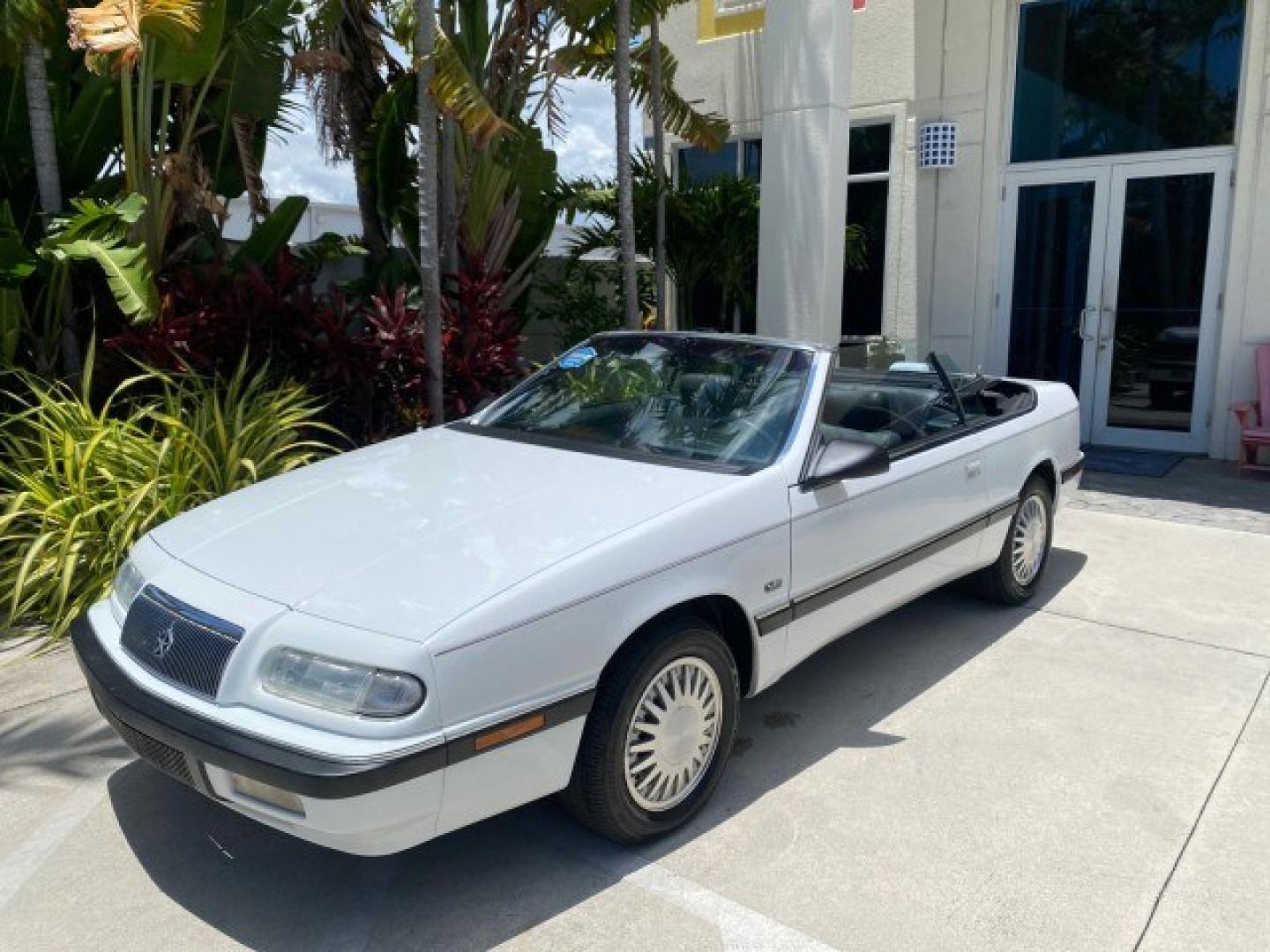 1993 White /Black Chrysler Lebaron CONV LX LOW MILES 26,305 (1C3XU5532PF) with an 3.0L SMFI 6-Cyl Engine engine, Automatic transmission, located at 4701 North Dixie Hwy, Pompano Beach, FL, 33064, (954) 422-2889, 26.240938, -80.123474 - OUR WEBPAGE FLORIDACARS1.COM HAS OVER 100 PHOTOS AND FREE CARFAX LINK 1993 Chrysler LeBaron Convertible 3.0L V6 F SOHC 12V Gasoline Front Wheel Drive Features ABS Brakes Air Conditioning Alloy Wheels AM/FM Stereo Automatic Transmission Cassette Player Cruise Control Leather Seats Power Locks Power S- Photo#85
