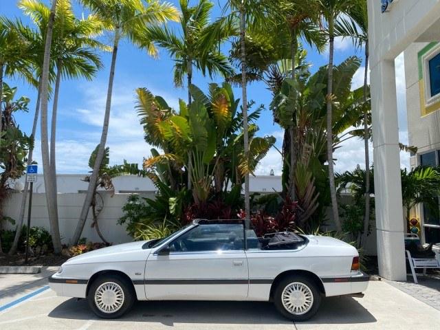 1993 White /Black Chrysler Lebaron CONV LX LOW MILES 26,305 (1C3XU5532PF) with an 3.0L SMFI 6-Cyl Engine engine, Automatic transmission, located at 4701 North Dixie Hwy, Pompano Beach, FL, 33064, (954) 422-2889, 26.240938, -80.123474 - OUR WEBPAGE FLORIDACARS1.COM HAS OVER 100 PHOTOS AND FREE CARFAX LINK 1993 Chrysler LeBaron Convertible 3.0L V6 F SOHC 12V Gasoline Front Wheel Drive Features ABS Brakes Air Conditioning Alloy Wheels AM/FM Stereo Automatic Transmission Cassette Player Cruise Control Leather Seats Power Locks Power S- Photo#86