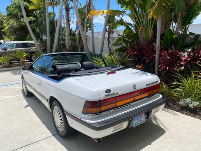 1993 White /Black Chrysler Lebaron CONV LX LOW MILES 26,305 (1C3XU5532PF) with an 3.0L SMFI 6-Cyl Engine engine, Automatic transmission, located at 4701 North Dixie Hwy, Pompano Beach, FL, 33064, (954) 422-2889, 26.240938, -80.123474 - OUR WEBPAGE FLORIDACARS1.COM HAS OVER 100 PHOTOS AND FREE CARFAX LINK 1993 Chrysler LeBaron Convertible 3.0L V6 F SOHC 12V Gasoline Front Wheel Drive Features ABS Brakes Air Conditioning Alloy Wheels AM/FM Stereo Automatic Transmission Cassette Player Cruise Control Leather Seats Power Locks Power S- Photo#89